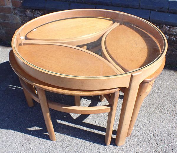 A MID-CENTURY TEAK COFFEE TABLE, WITH THREE NESTING, PROBABLY NATHAN
