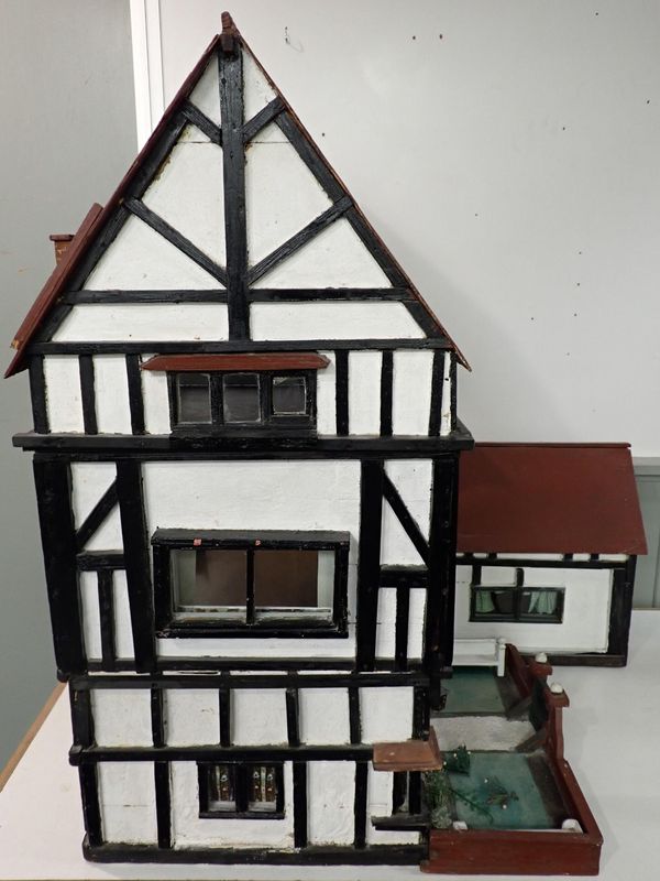 A LARGE 1920s TIMBER-FRAMED DOLL'S HOUSE; 'THE HALL'