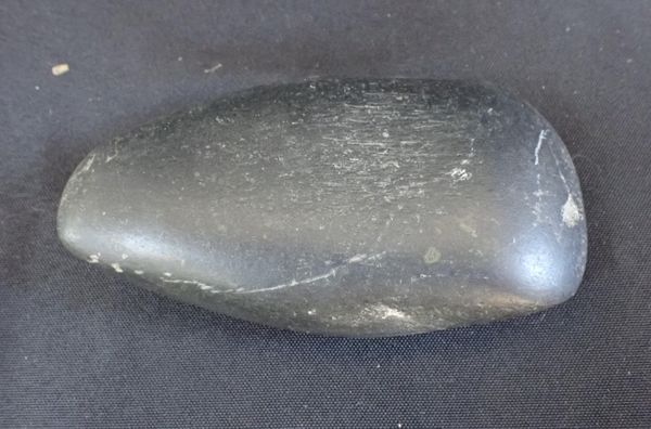 AN ETHNOGRAPHICAL STONE AXE