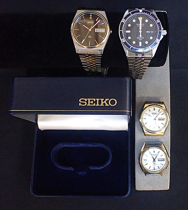 A SEIKO QUARTZ SQ BOXED 'DAY AND DATE' WATCH