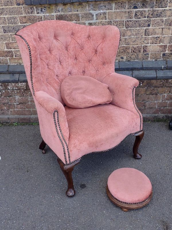 A 1920s BARREL-BACK WING ARMCHAIR