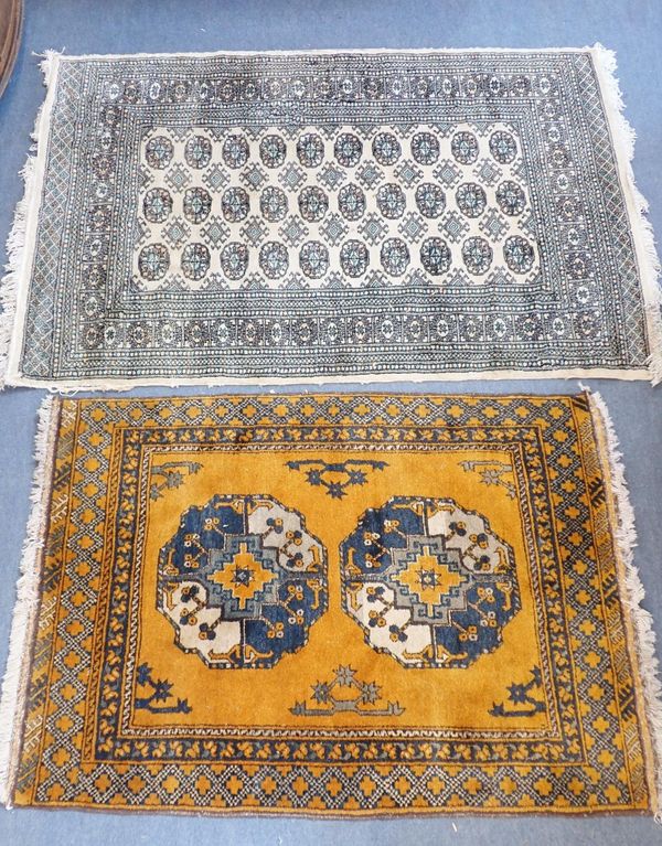 A BOKHARA RUG, WITH GOLD GROUND