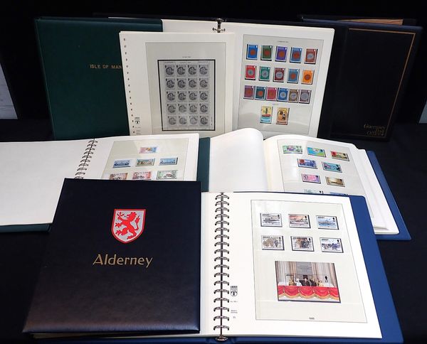 CI AND IOM STAMPS IN 7 BOXED LINDNER HINGELESS ABLUMS