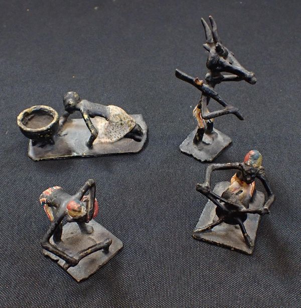 FOUR AFRICAN MINIATURE PAINTED BRONZE FIGURES