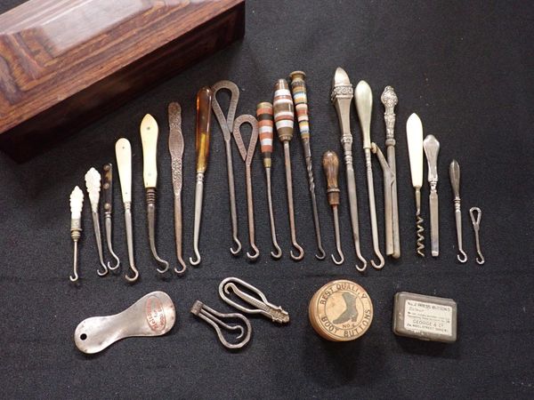 A COLLECTION OF BUTTON HOOKS AND OTHER ITEMS