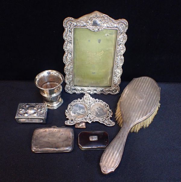 A REPOUSSE SILVER DOUBLE PHOTO FRAME