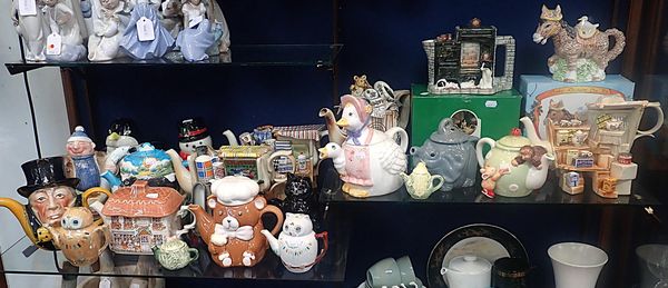 A COLLECTION OF NOVELTY TEAPOTS