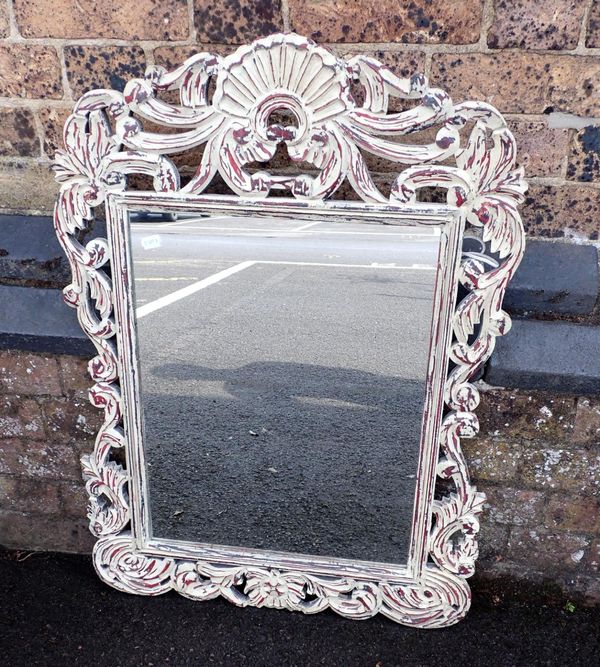 A WALL MIRROR, WITH CARVED HARDWOOD FRAME