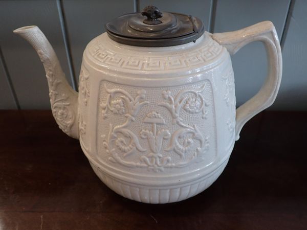 A VICTORIAN RELIEF MOULDED OVERSIZED TEAPOT