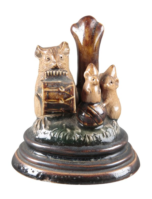 A DOULTON STONEWARE MENU HOLDER BY GEORGE TINWORTH 'THE CONJURORS'