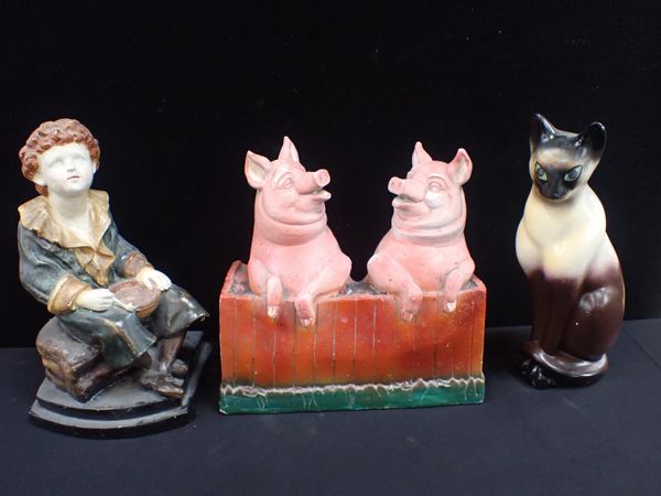 A PAINTED CERAMIC COMICAL PIG FIGURE