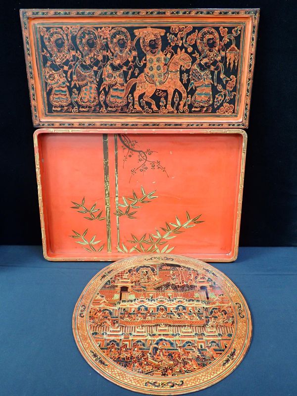 TWO MALAYASIAN RED LACQUERED TRAYS AND A JAPANESE RED LACQUERED TRAY