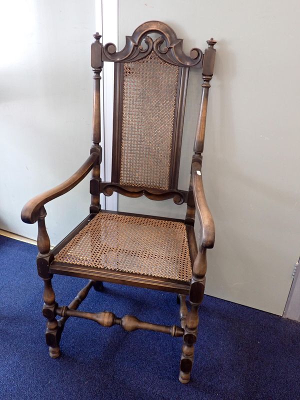 A CAROLEAN STYLE CANED ARMCHAIR
