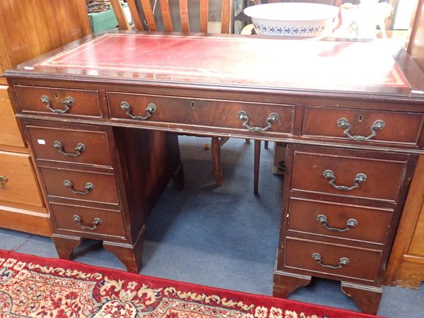 A REPRODUCTION MAHOGANY PEDESTAL DESK