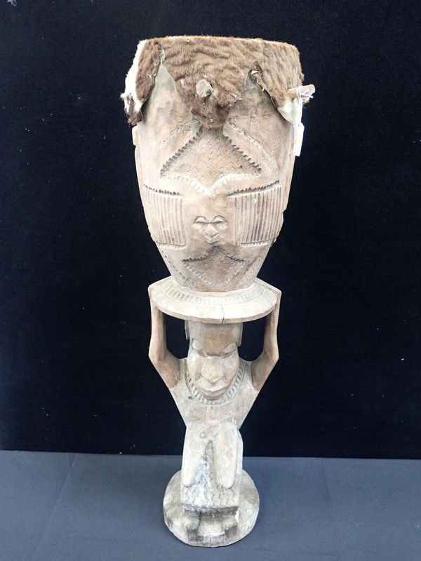 AN AFRICAN PEG DRUM WITH FIGURAL SUPPORT