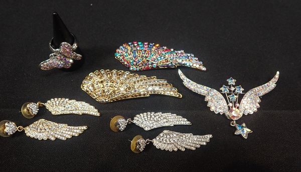 BUTLER & WILSON: THREE WING BROOCHES