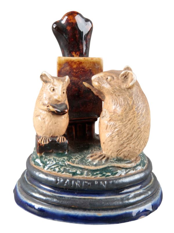 A DOULTON STONEWARE MENU HOLDER BY GEORGE TINWORTH 'PAINTING'