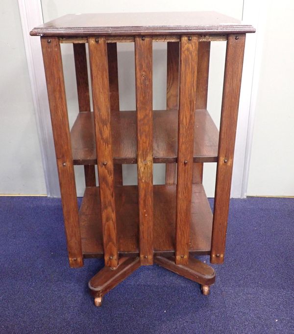 AN OAK REVOLVING BOOKCASE