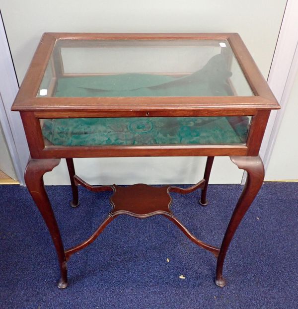 AN EDWARDIAN GLAZED MAHOGANY BIJOUTERIE CABINET