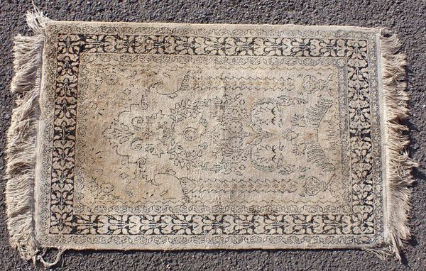 A SMALL INDIAN SILK RUG