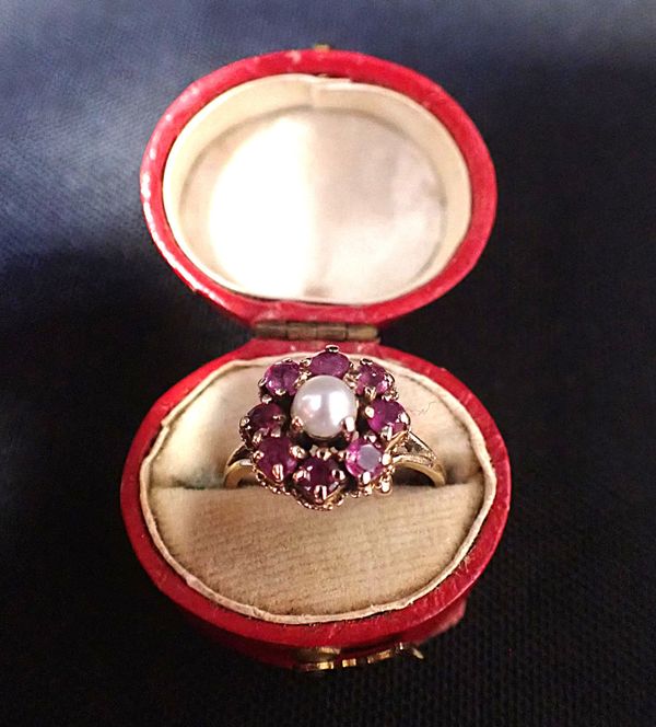 A PEARL AND RUBY CLUSTER RING