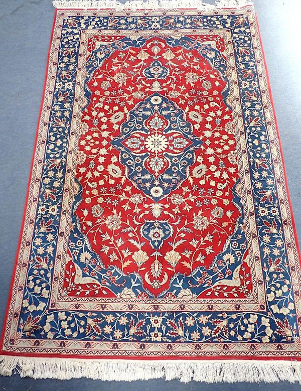 A CHINESE RUG OF PERSIAN DESIGN