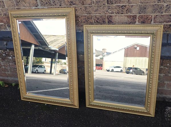 TWO MOULDED AND GILT FRAMED MIRRORS