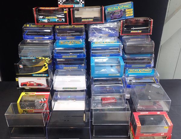 A LARGE QUANTITY OF EMPTY SCALEXTRIC CAR DISPLAY CASES