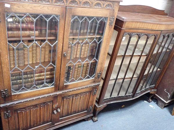 A 1930s MAHOGANY SERPENTINE DISPLAY CABINET