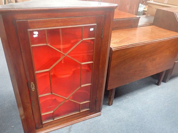 A GEORGE III DROP-LEAF DINING TABLE