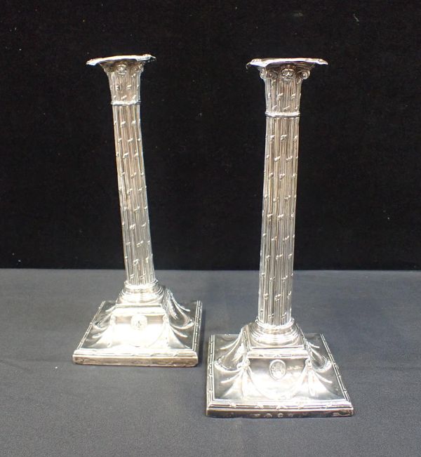 A PAIR OF SILVER CANDLESTICKS BY  JOHN WINTER & Co