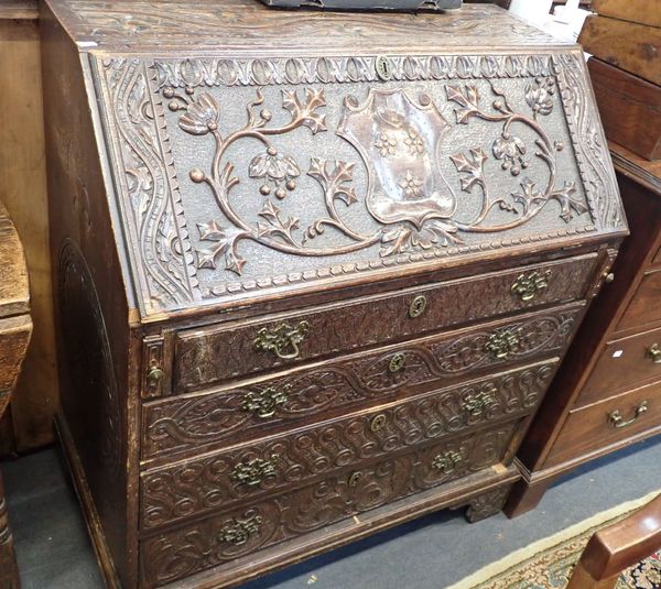 A 19TH CENTURY OAK BUREAU