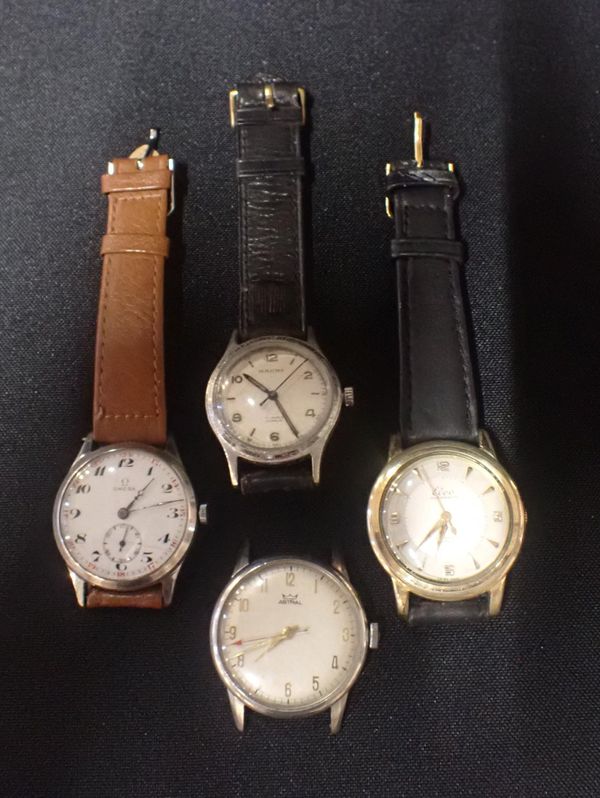 AN OMEGA STAINLESS STEEL WRIST WATCH