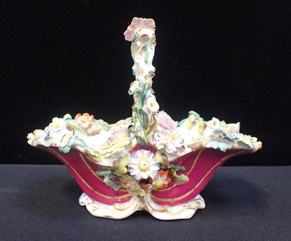 A 19th CENTURY ROCKINGHAM STYLE FLORAL BASKET