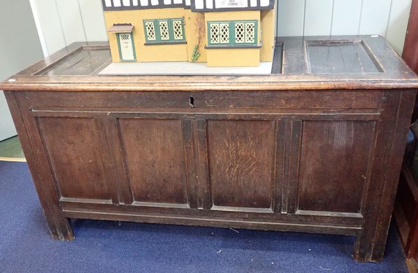 A LARGE OAK PANELLED COFFER