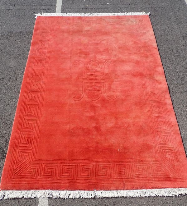 A LARGE RASPBERRY RED CHINESE RUG
