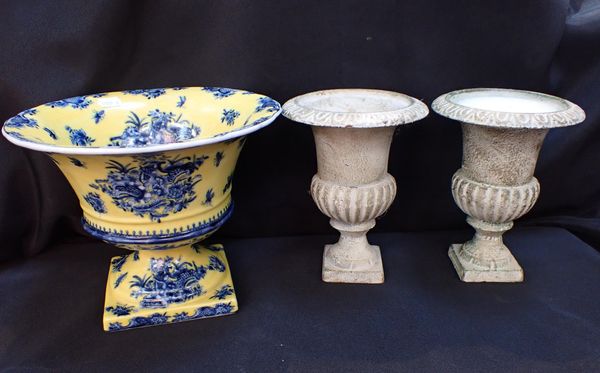 A PAIR OF SMALL CAST IRON URNS