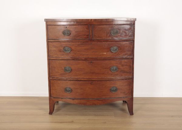 A GEORGE III MAHOGANY AND CROSSBANDED BOWFRONT CHEST OF DRAWERS