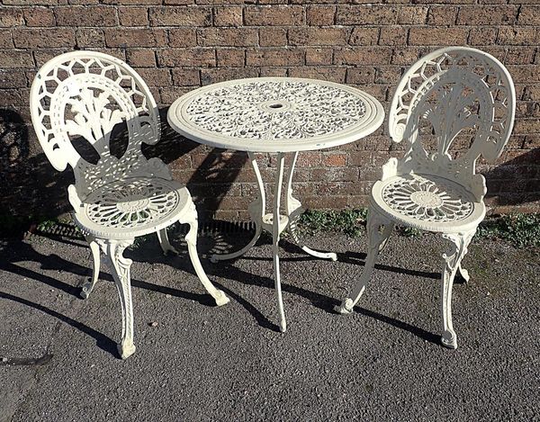 A CAST METAL GARDEN TABLE AND TWO CHAIRS