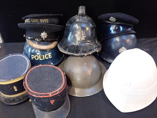 A COLLECTION OF MILITARY AND OTHER HATS, CAPS, AND HELMETS