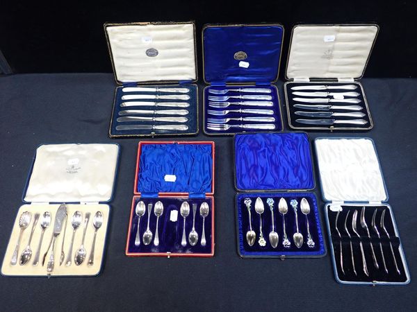 BOXED SETS OF SILVER TEASPOONS AND SILVER HANDLED DESSERT SETS