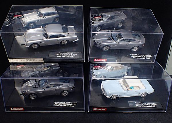 FOUR CARRERA EVOLUTION 'JAMES BOND' SLOT CARS