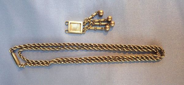 A YELLOW METAL CHAIN