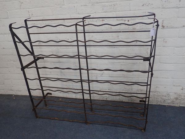 AN OLD IRON WINE RACK