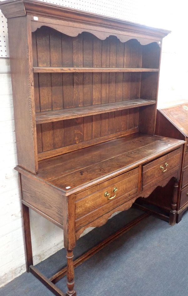 AN OAK DRESSER, WITH PLATE RACK AND TWO DRAWERS