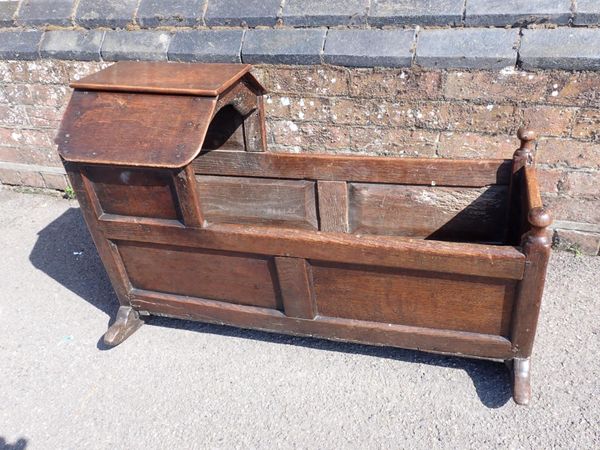 A GEORGE III OAK CRADLE