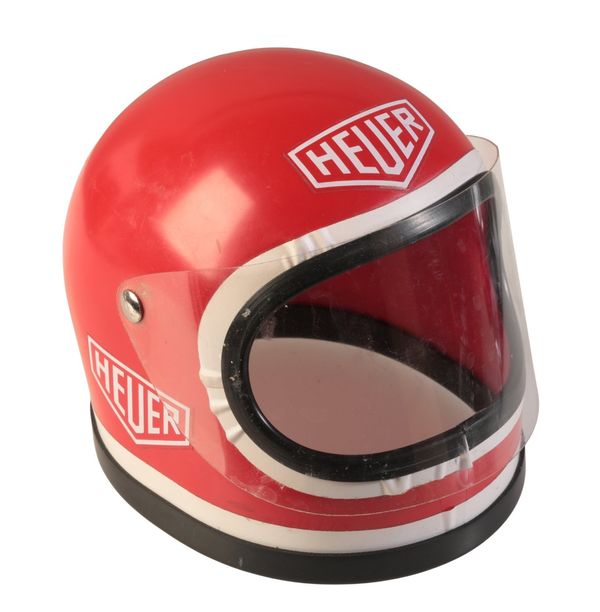 TAG HEUER: A WATCH ADVERTISING DISPLAY OF A MINIATURE RACING CAR HELMET