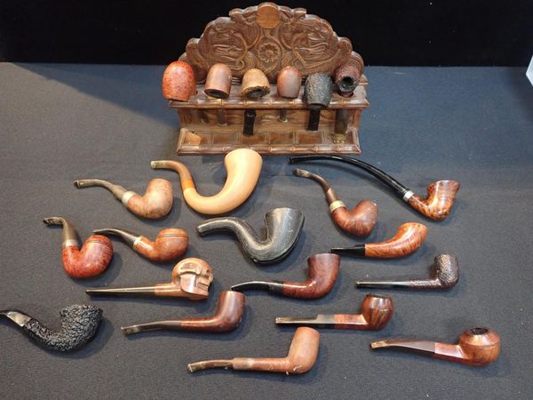 A CARVED PIPE RACK