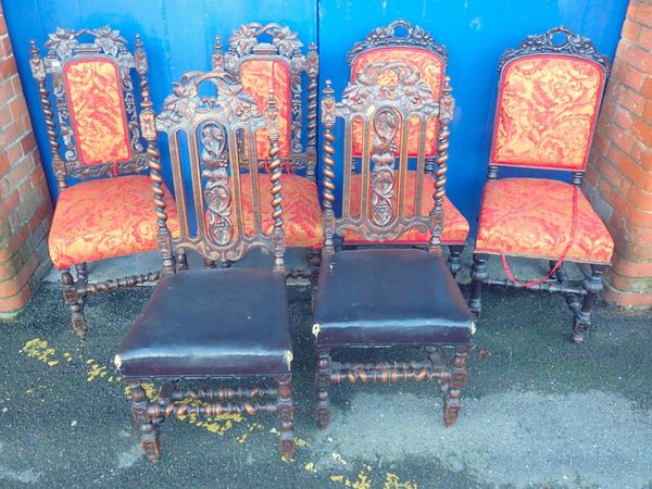 A HARLEQUIN SET OF VICTORIAN CARVED OAK DINING CHAIRS