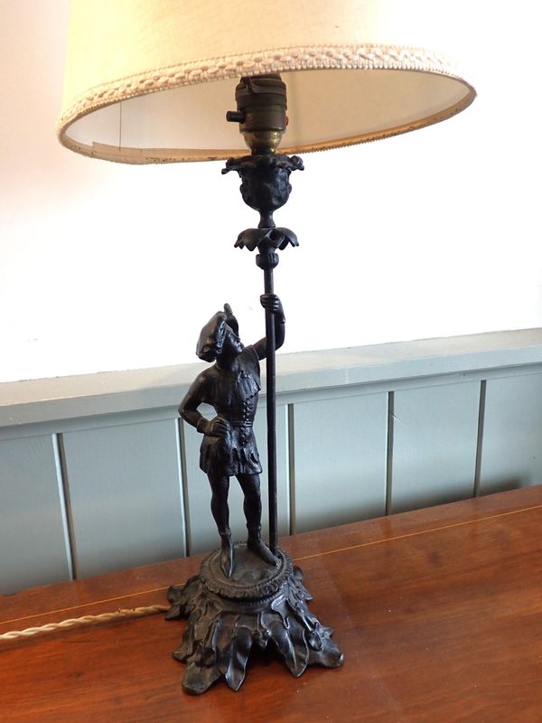 A CAST IRON FIGURAL TABLE LAMP